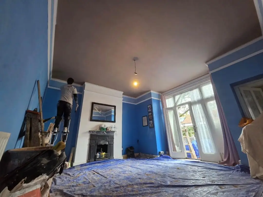 Plastering a three-metre ceiling on stilts, with the room sheeted, by ST Plastering & Rendering