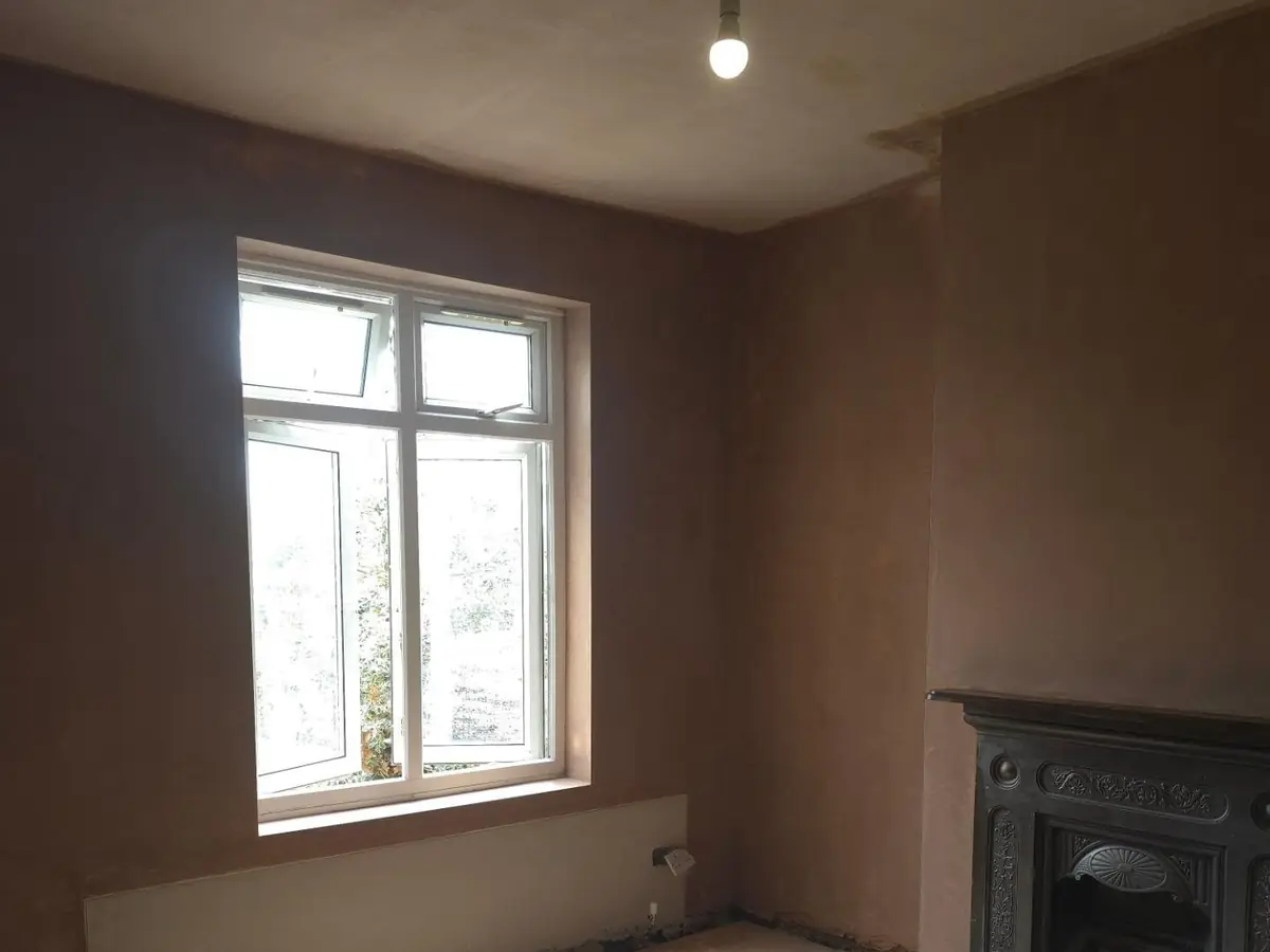 Ceiling and walls skimmed, original fireplace kept, by ST Plastering & Rendering