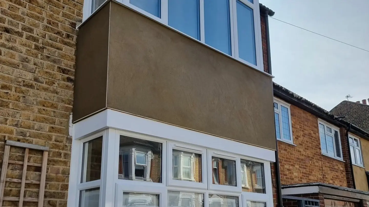 Terraced house bay rendered smooth over old pebble dash by ST Plastering & Rendering