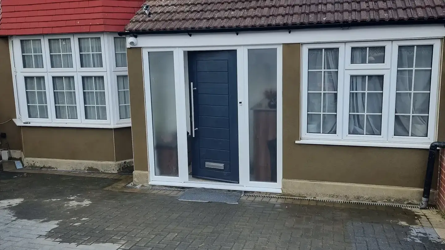 House front and porch rendered in sand and cement by ST Plastering & Rendering