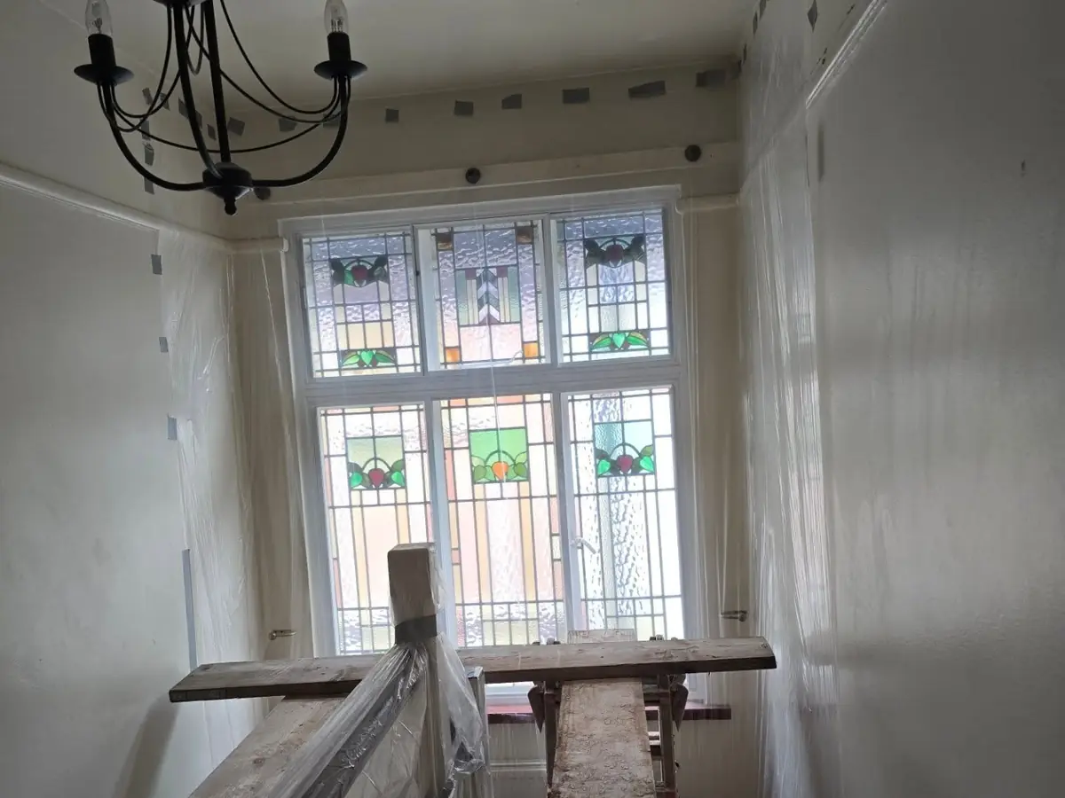 Stairwell skimmed around the original stained glass — ST Plastering & Rendering