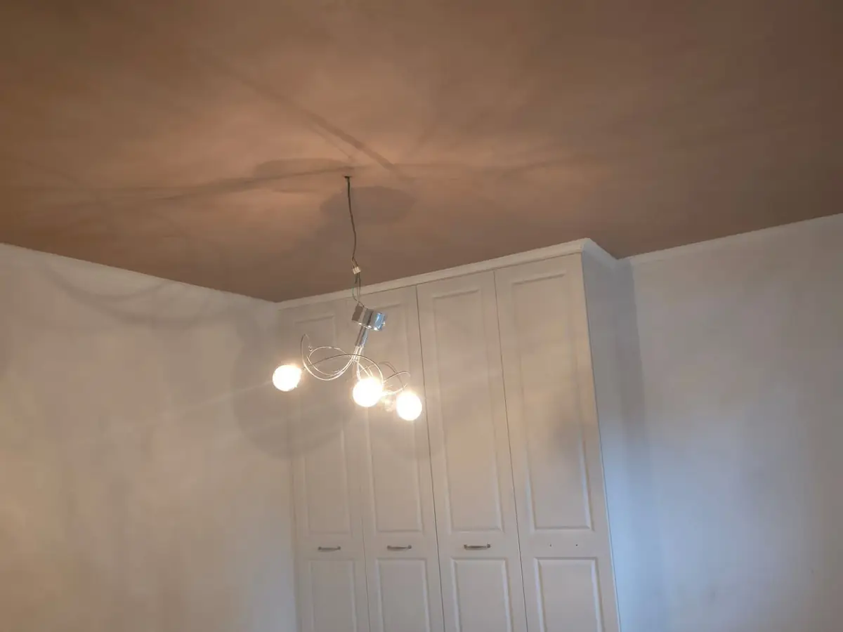Ceiling skimmed flat over old Artex by ST Plastering & Rendering