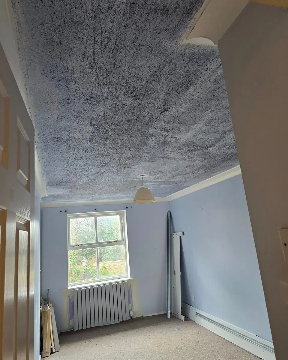 Heavily textured bedroom ceiling before skimming