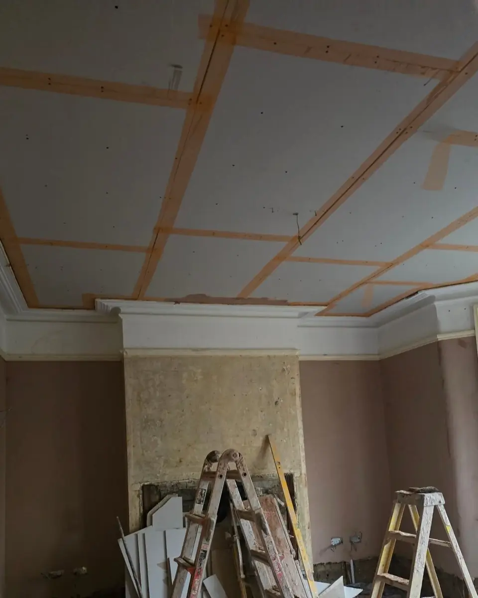 Whole ceiling over-boarded with scrimmed joints and the original cornice kept, by ST Plastering & Rendering