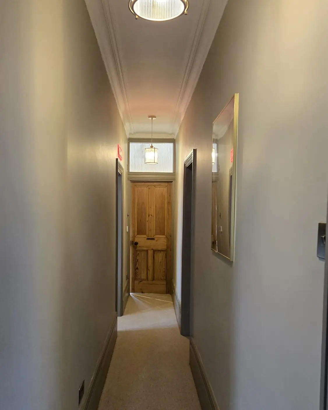 Hall ceiling and walls skimmed, pictured after decorating, by ST Plastering & Rendering