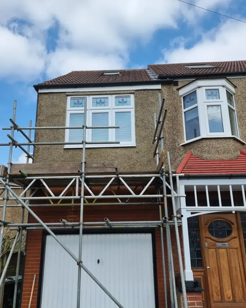 The same house front with new pebbledash round the bay and extension, by ST Plastering & Rendering