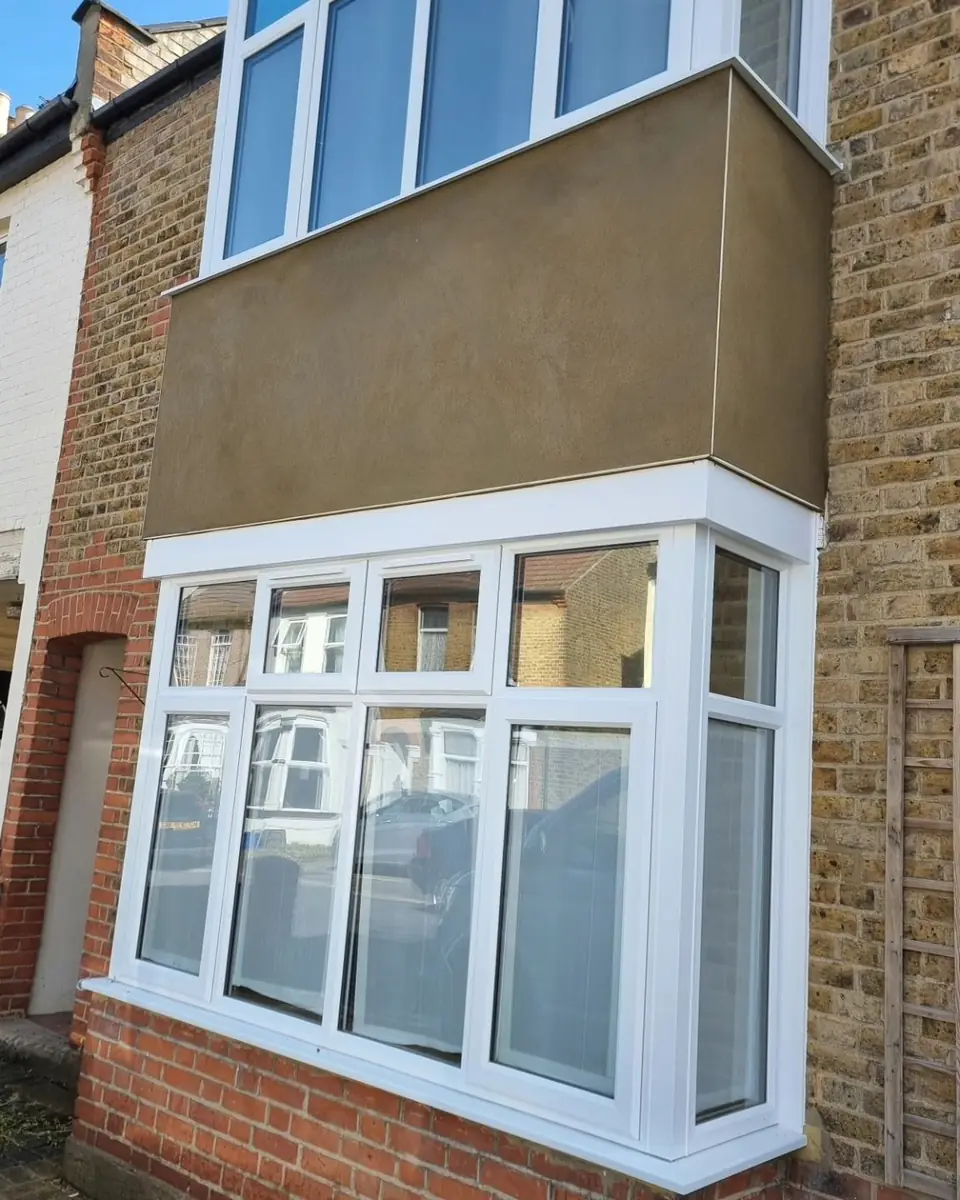 The same terraced bay with a smooth new render panel, by ST Plastering & Rendering